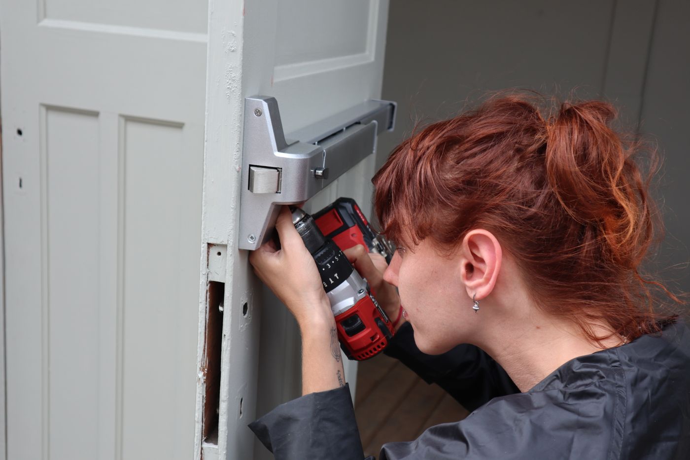 Technician completing a documented warranty repair in a suite